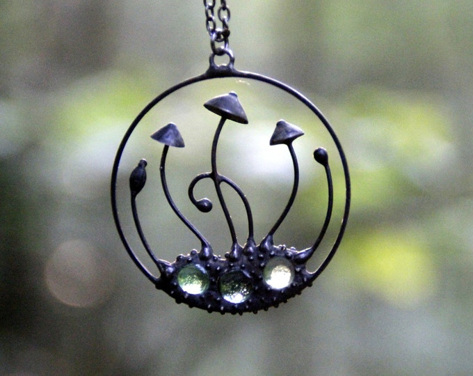 Handmade mushrooms round metal black pendant with green glass, wild nature festival rave clothing, shrooms jewelry.