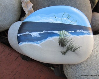 On the beach, painted stones, stone art, beach landscape on cast stone,