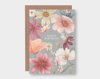 May include: A gray card with a floral design and the text "Happy Birthday" in white. The flowers are pink, white, and peach.