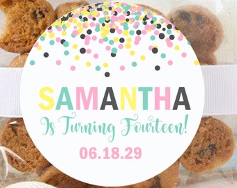 May include: A white circle sticker with a confetti pattern in pink, yellow, teal, and black. The sticker says "SAMANTHA is turning Fourteen! 06.18.29" in a colorful font.