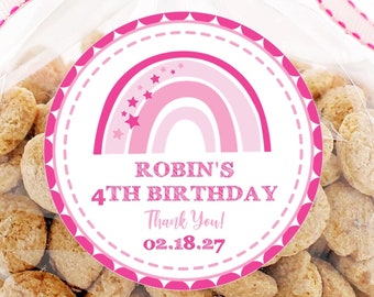May include: Pink and white circle sticker with a rainbow and stars. The sticker says "Robin's 4th Birthday" and "Thank You! 02.18.27".
