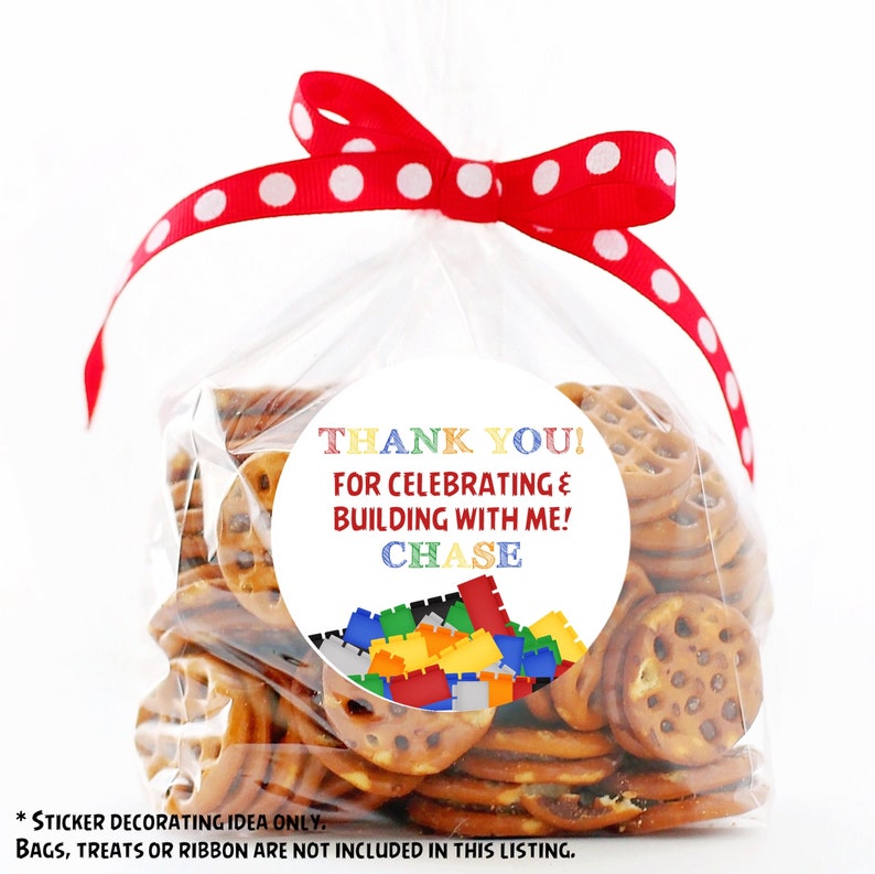 May include: A round sticker with a white background and colourful text that says "Thank You! For Celebrating & Building With Me! Chase". The sticker has a colourful image of Lego blocks around the text.