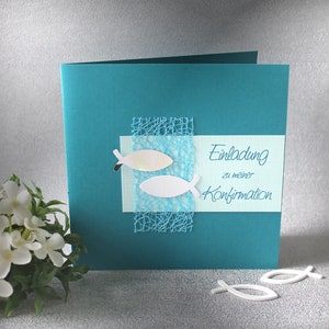 May include: Teal card with a white and light blue fish design and the text "Einladung zu meiner Konfirmation" on a light blue background.