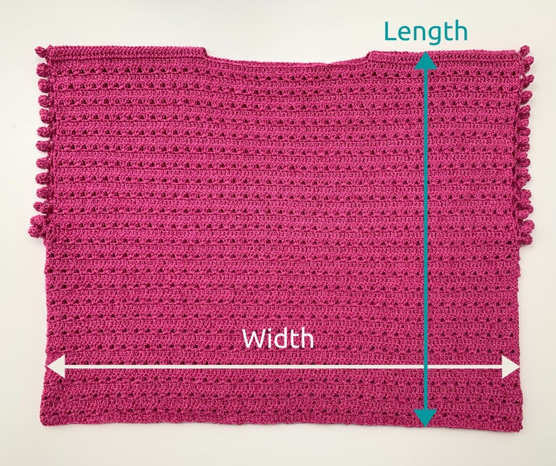 May include: A pink crocheted top with a scalloped edge and a length of approximately 18 inches and a width of approximately 20 inches.
