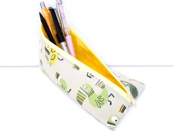 Green pencil case with bird motif, triangular pencil case