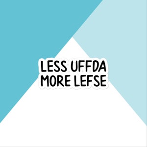 May include: White sticker with black text that reads "Less Uffda More Lefse".