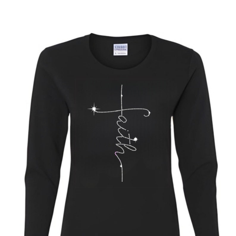 May include: Black long-sleeve shirt with a rhinestone cross and the word "faith" spelled vertically.