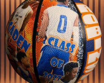 Pode incluir: Uma bola de basquete com um design azul, laranja e branco. A bola de basquete tem o texto "CADEN" e "CLASS OF 2027" impresso nela.