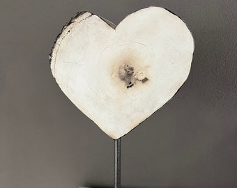 Wooden heart on a metal stick