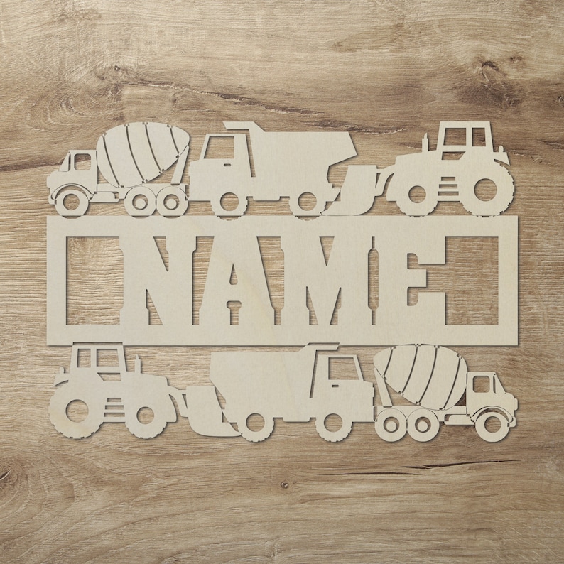 May include: White wooden cutout of a name sign with a cement mixer, dump truck, tractor and excavator. The sign says "NAME".