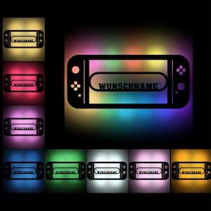 Puede incluir: Una silueta negra de una consola Nintendo Switch con el texto "WUNSCHNAME" mostrado en la pantalla. La consola está rodeada de un fondo degradado de colores con tonos de amarillo, naranja, rojo, rosa, morado, azul, verde y blanco.