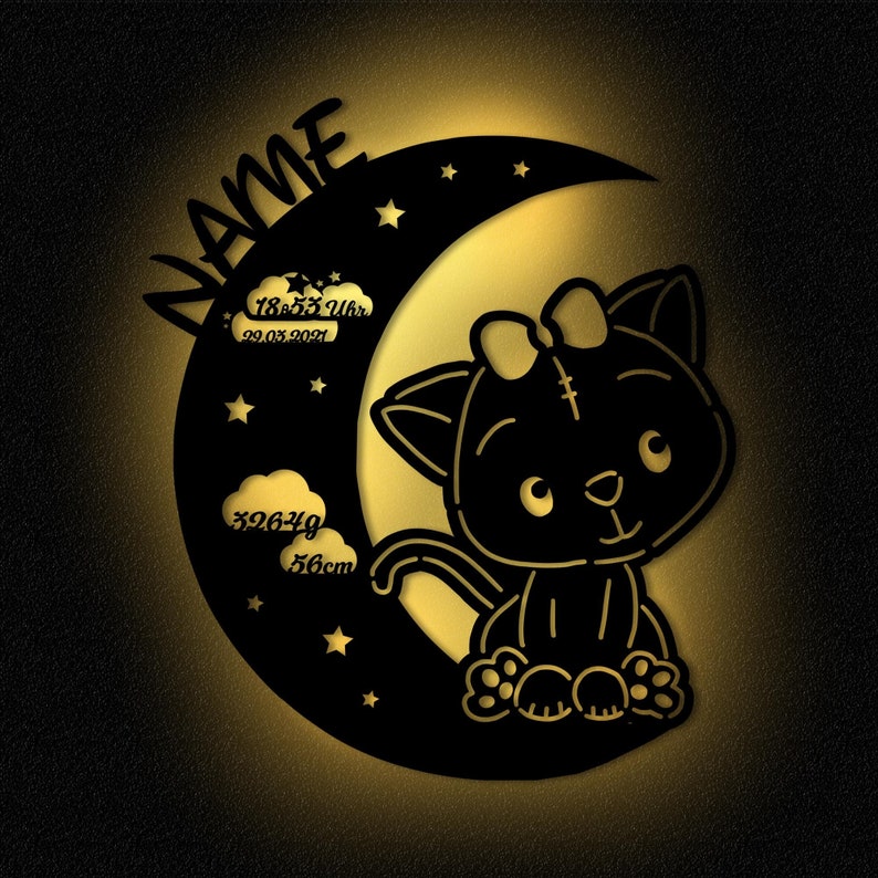 May include: Black silhouette of a cat with a bow sitting on a crescent moon with stars. The moon has text that reads "NAME", "18:55 Uhr", "22.03.2021", "3264g", and "56cm".