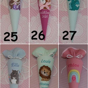 May include: Six cone-shaped fabric gift bags with waffle texture, each featuring a drawstring top and personalized embroidery. Designs include a mermaid, deer, dragon, hamster, lion, and rainbow, labeled with numbers 25 through 30.