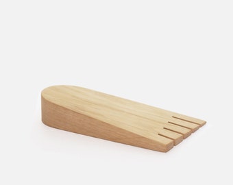Oak foot-shaped door wedge