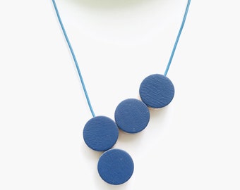 Blue leather necklace with wooden band and magnetic clasp