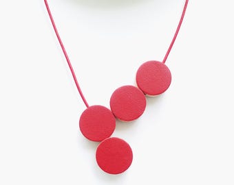 red leather necklace with wooden band and magnetic clasp
