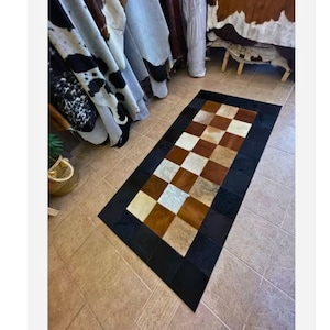 Cowhide Patchwork Rug with Black Border – Handmade Natural Leather Carpet in Brown, White & Beige – Luxury Modern Hallway Area Rug