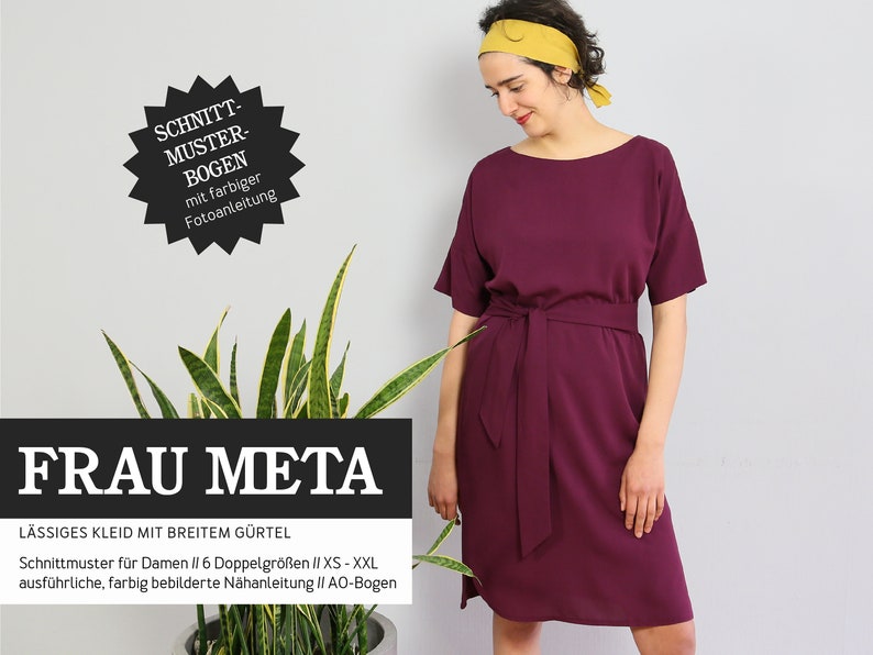 May include: A sewing pattern for a loose-fitting dress with a wide belt. The pattern is called "Frau Meta" and includes instructions for sizes XS to XXL. The pattern is illustrated with color photos.