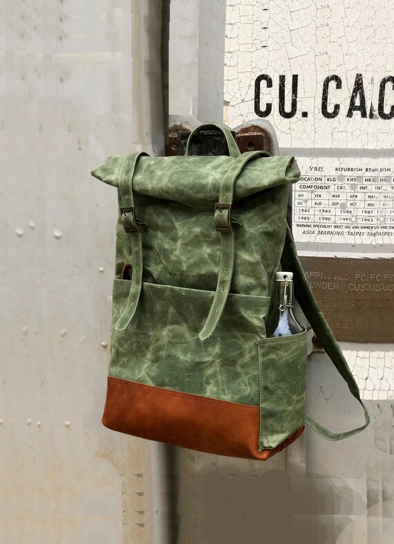 canvas backpack with water bottle pocket