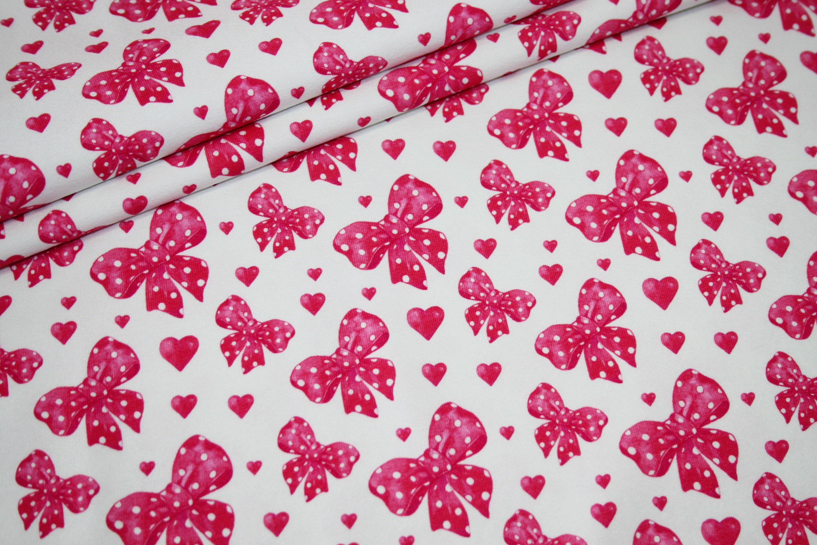 Stenzo digital print jersey fabric white bows pink