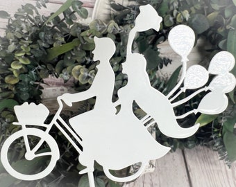 Bridal couple on bicycle with balloons as metal plugs in white cake topper cake topper wedding white