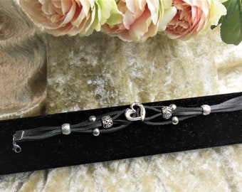 Black leather bracelet with silver sliding beads