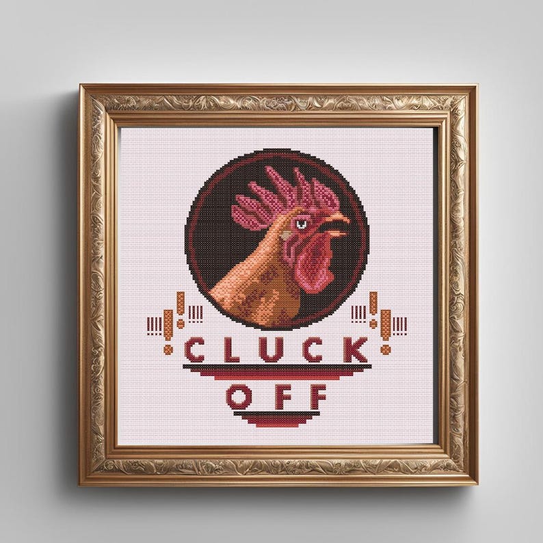 May include: A framed cross-stitch design featuring a rooster with a red comb and wattle, set against a black background. The text "CLUCK OFF" is written in red and black letters below the rooster.