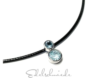 Pendant 925/- rhod blue topaz round faceted with braided textile band leather look 45 cm