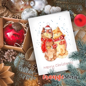 Cartão de feliz Natal em aquarela para impressão. Cartão postal de presente de inverno para download instantâneo. Felizes e fofos abraçando gatos com lenços e luvas.