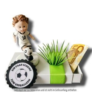 Money gift box footballer