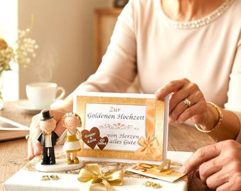 Money gift for a golden wedding anniversary with a golden couple and a greeting card
