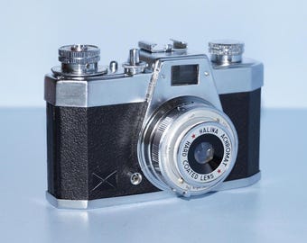 1970年代のヴィンテージ Petri FT 35 mm フィルムカメラ（革製ケース