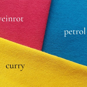 May include: Three fabric swatches in different colors: a bright red, a deep blue, and a bright yellow. The swatches are labeled "weinrot", "petrol", and "curry" respectively.