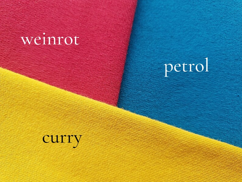 May include: Three fabric swatches in different colors: a bright red, a deep blue, and a bright yellow. The swatches are labeled "weinrot", "petrol", and "curry" respectively.