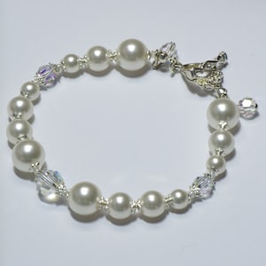 Luxury Bracelet with Swarovski stones. Swarovski White glass beads. Silver chapter closure. 20.5 cm (XL)