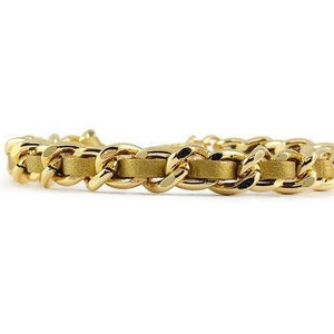 May include: A gold chain bracelet with a flat, textured design.