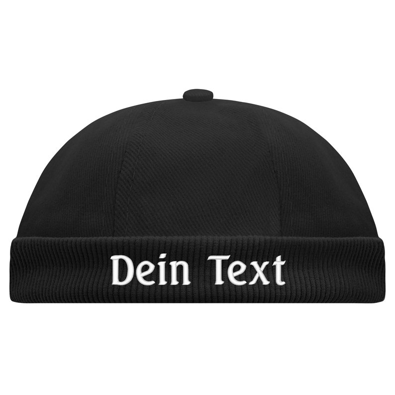 May include: Black beanie with a ribbed cuff and the text "Dein Text" embroidered in white.