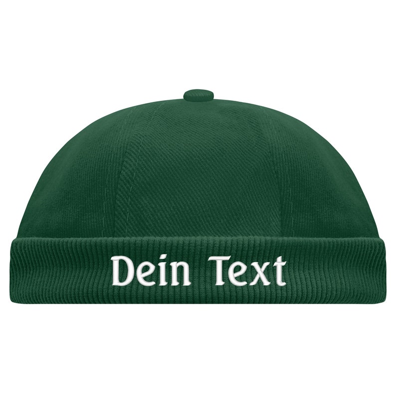 May include: A dark green beanie with a folded brim and the text "Dein Text" embroidered in white.