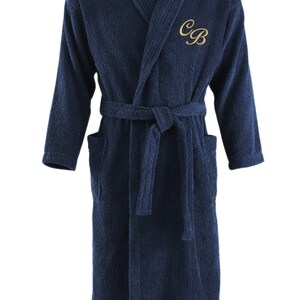 May include: A navy blue bathrobe with a white collar and a gold embroidered monogram "CB".