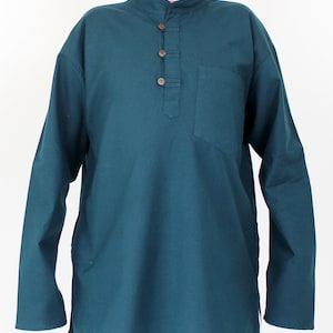 May include: Teal long-sleeve shirt with a mandarin collar and a three-button placket. The shirt has a single chest pocket and is made of a soft, solid-colored fabric. The shirt has a relaxed fit.
