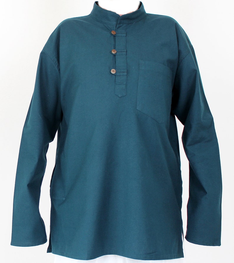 May include: Teal long-sleeve shirt with a mandarin collar and a three-button placket. The shirt has a single chest pocket and is made of a soft, solid-colored fabric. The shirt has a relaxed fit.
