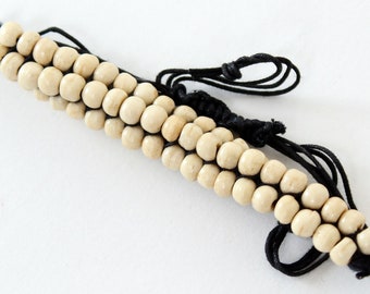 Beautiful white bracelet made of wooden beads handmade