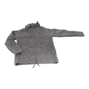 May include: A gray, hooded zip-up jacket with a textured knit appearance. The jacket features a full-length zipper, two front pockets, and a drawstring at the hem. A small brown tag is visible near the bottom.
