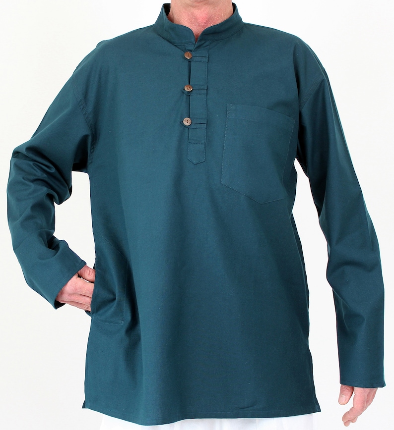 May include: Teal long-sleeve shirt with a mandarin collar and a button-down placket. The shirt features a single chest pocket and two side pockets. The buttons are a light brown color. The shirt is made of a soft, comfortable material.