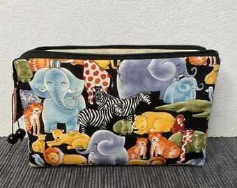 Cosmetic bag with three compartments and a zipper
