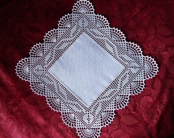 Hardanger crochet patchwork doily with tendrils in white