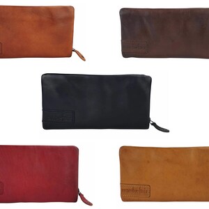 May include: Five leather zippered pouches in different colors: brown, dark brown, black, red, and light brown. Each pouch has the word "marblefair" embossed on the front.