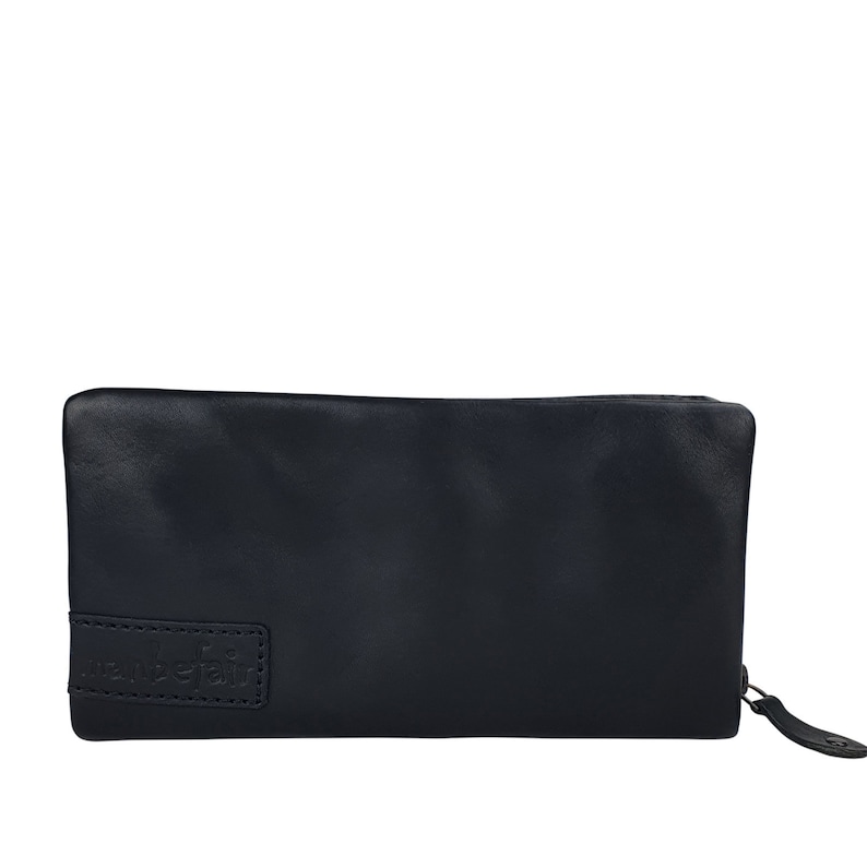 May include: A black leather zippered wallet with the word "wanderlust" embossed on the front.