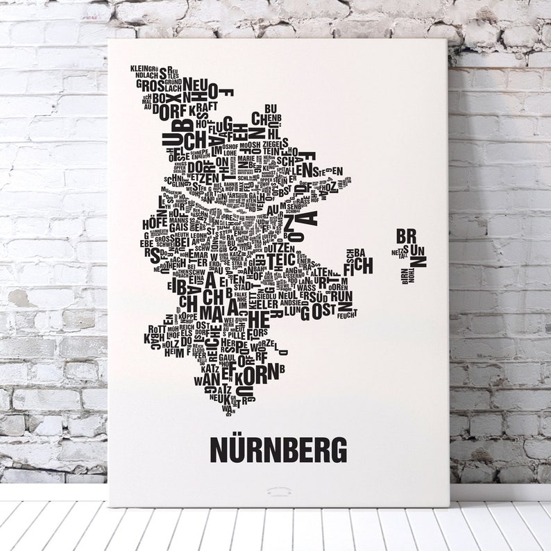 May include: A black and white word cloud art print of the city of Nuremberg, Germany. The word cloud is shaped like the city's outline and includes many of the city's neighborhoods and landmarks. The print is titled "N&uuml;rnberg" at the bottom.
