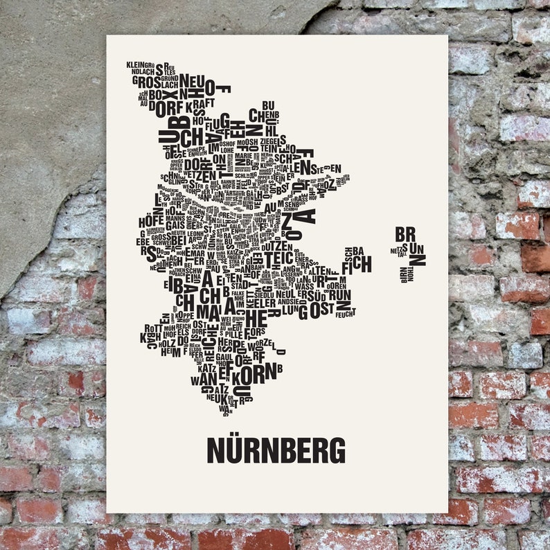 May include: A black and white typography art print of the city of Nuremberg, Germany. The print features the city's name in large letters at the bottom and a map of the city made up of words related to Nuremberg.